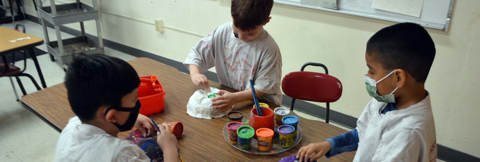 Students crafting with paper in art class